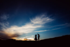 Silhouette of a bride and groom dancing