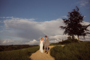 Bride & Grooms walking in the cotswold hills