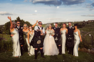 Bride & Groom spraying champagne