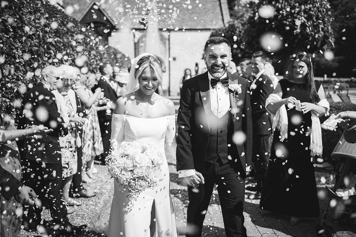 Bride & Groom in the sunshine at Kingscote Barn